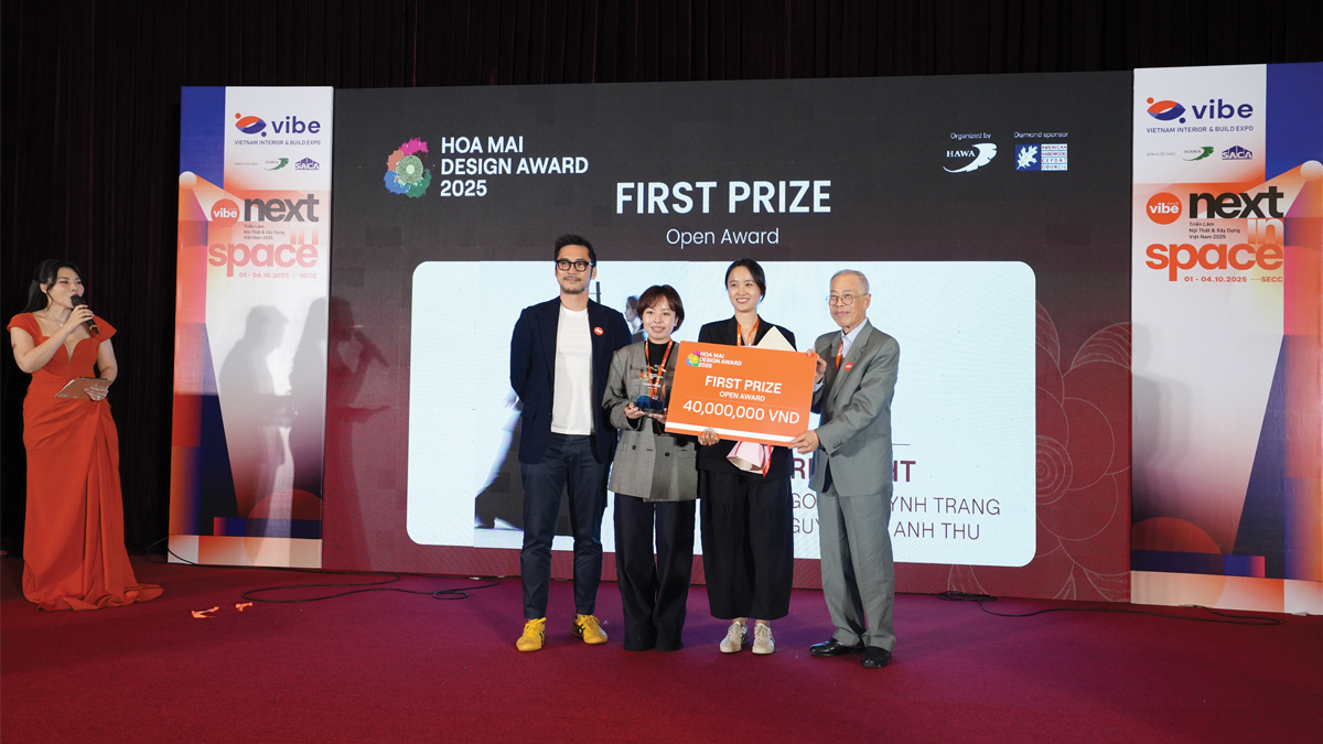 Ground level of green leaf on pyramid of pellets placed near stack of chopped firewood of various types and biomass briquettes in daylight