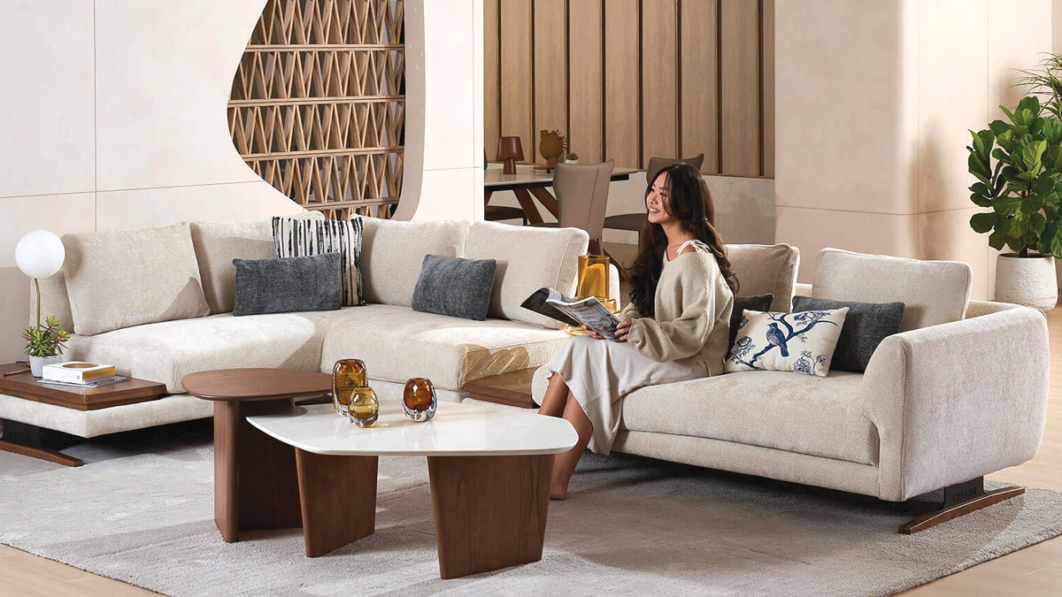 Ground level of green leaf on pyramid of pellets placed near stack of chopped firewood of various types and biomass briquettes in daylight