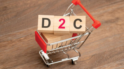 Concept of D2C (Direct to customer), shopping cart and the word D2C