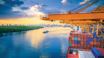 Import Cargo River Side And Containers On Top Of Shipyard At Sunset View