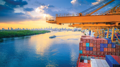 Import Cargo River Side And Containers On Top Of Shipyard At Sunset View