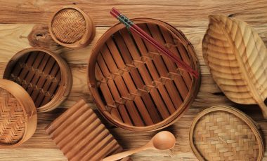Various Size of Traditional Asian Kitchen Utensil Bamboo Steamer Set Over  Wooden Background. Top View, Flat Lay. Copy space for Text.